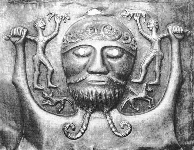 Primitive metal carving of the ancient father-god Dagda.